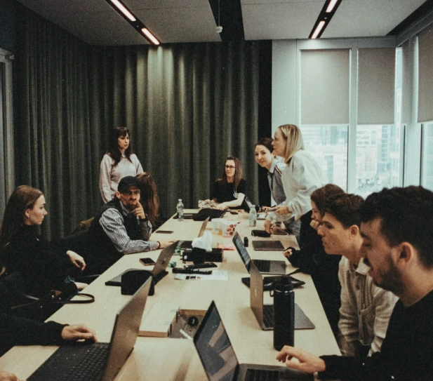 Members around a long table at a working session