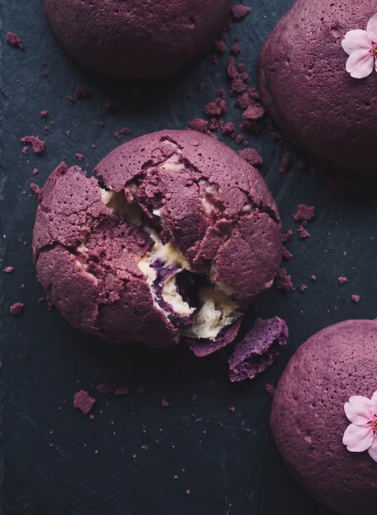 Sakura Ube Conrad — an ube cookie-crust bun crowned with a preserved sakura blossom